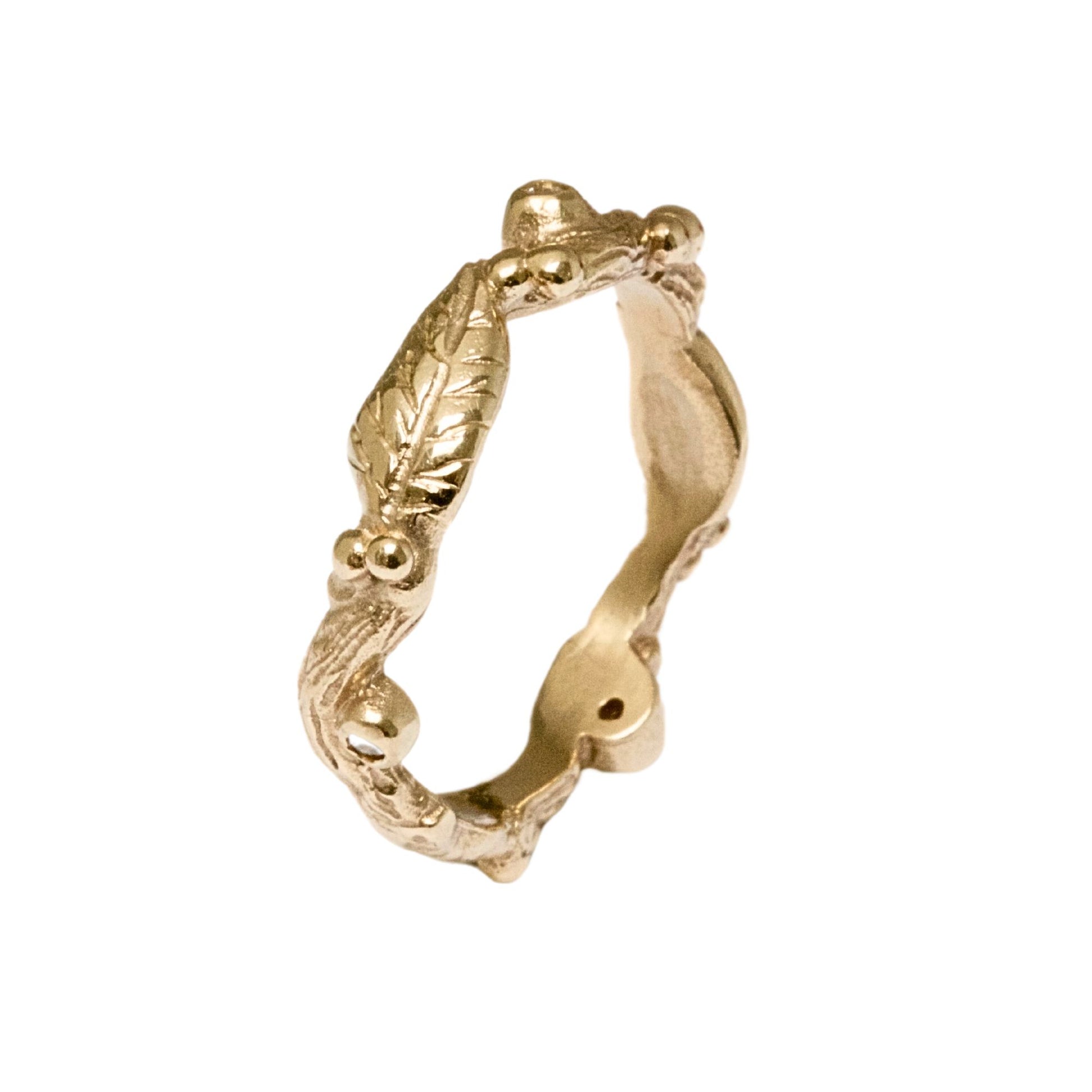 Nature inspired 9ct gold leaf ring, a carved woodland ring with twigs, leaves and berries and studded with champagne, white and salt and pepper natural diamonds. For nature lovers and woodland weddings.