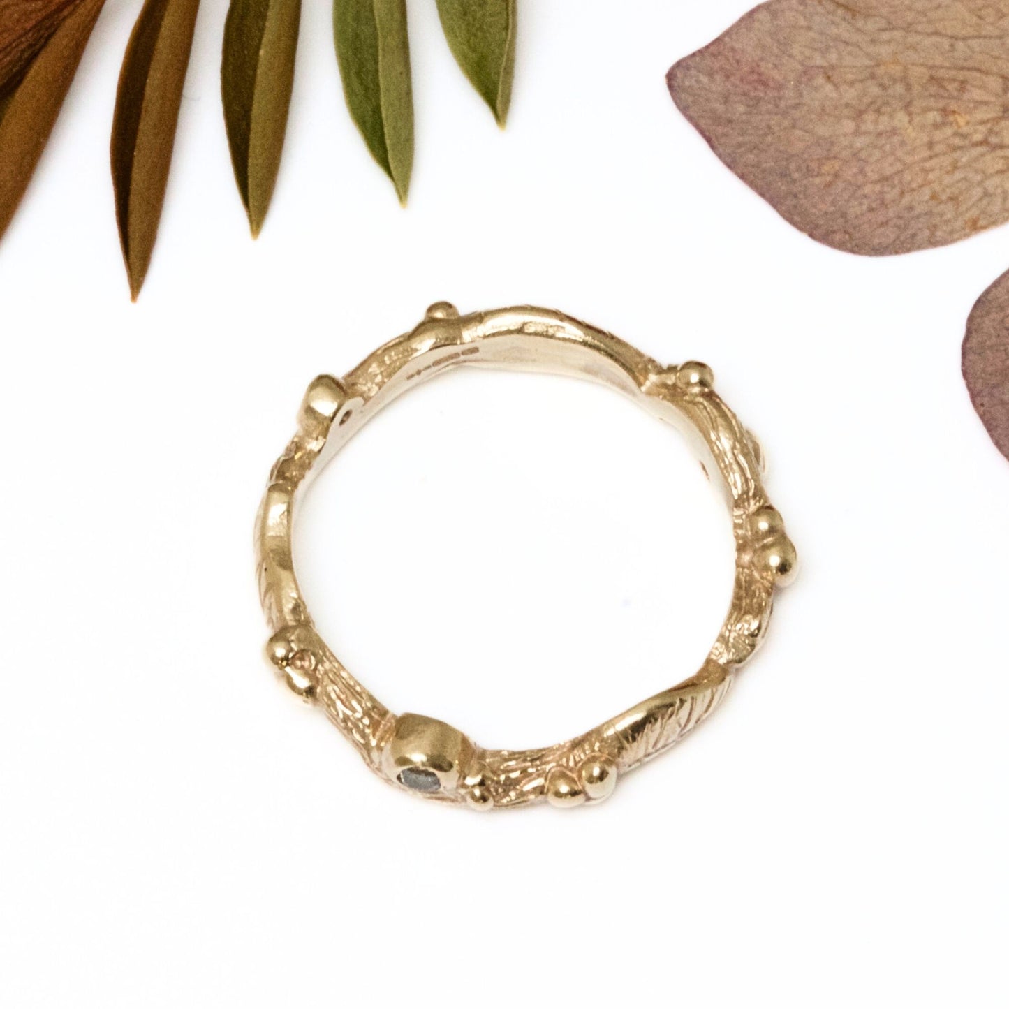 Nature inspired 9ct gold leaf ring, a carved woodland ring with twigs, leaves and berries and studded with champagne, white and salt and pepper natural diamonds. For nature lovers and woodland weddings.