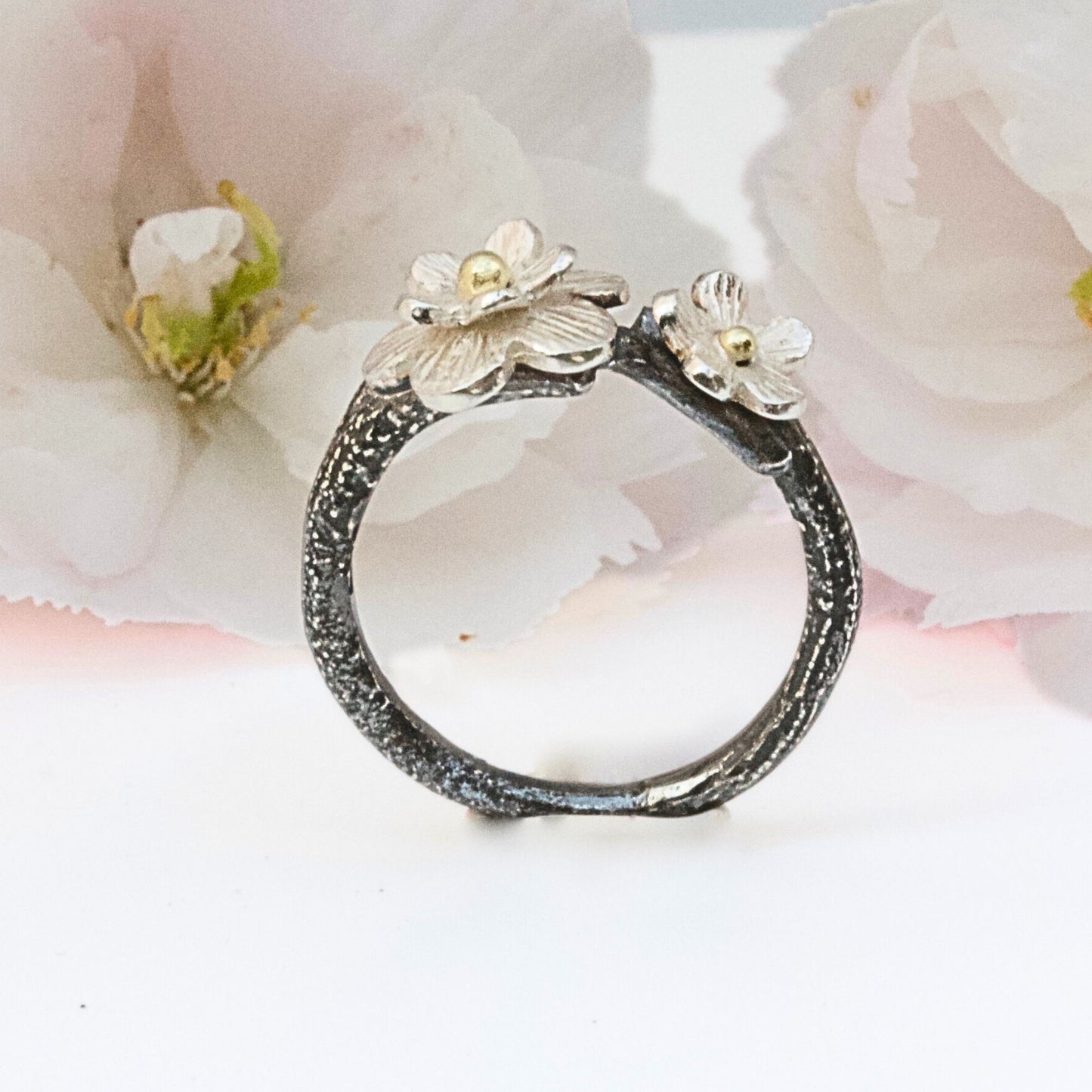 Oxidised silver and 18 carat gold flower ring. Mixed metal Cherry Blossom floral ring.